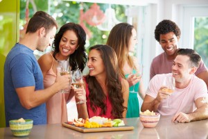 Group Of Friends Enjoying Drinks Party At Home