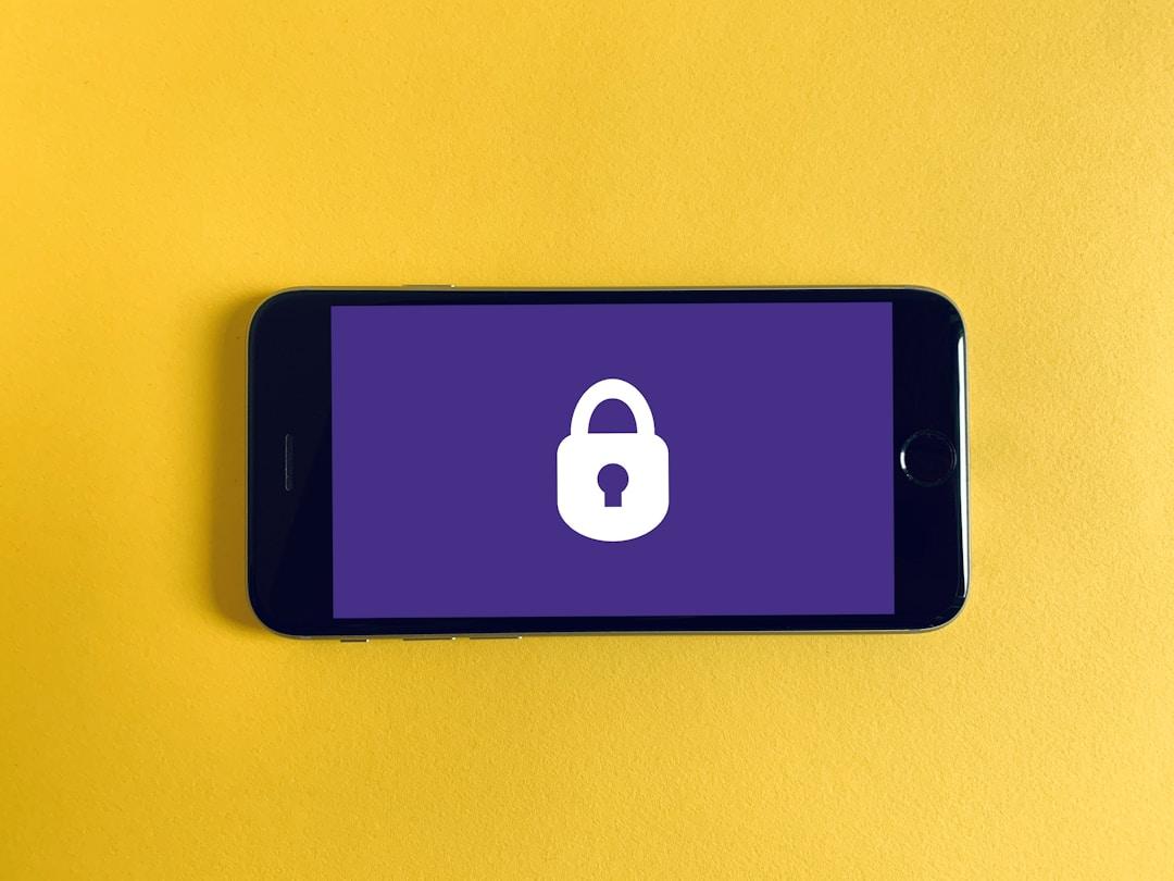 Mobile phone screen displaying a padlock symbol, representing data security with cloud faxing.