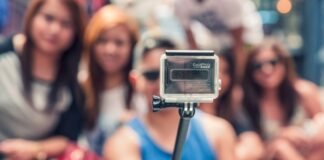 Girls taking selfie with selfie stick