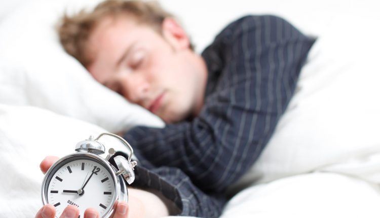 Man Sleeping with Clock