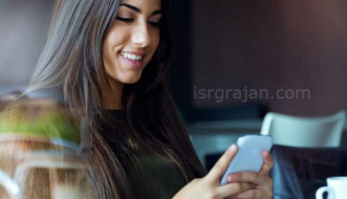 girl using smartphone on the table