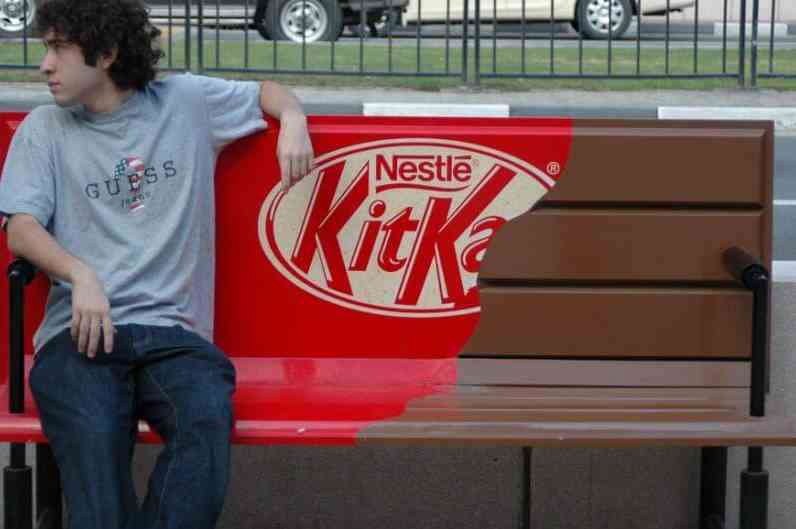 Man sitting on Kit Kat Bench