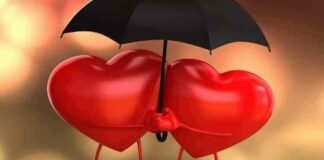 Two hearts under umbrella