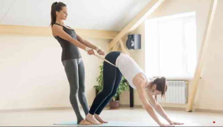 Yoga Instructor Assisting