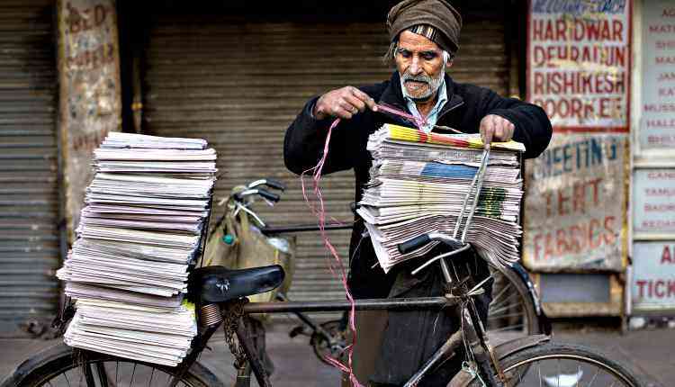 Old man, news seller