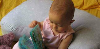 Small baby with book