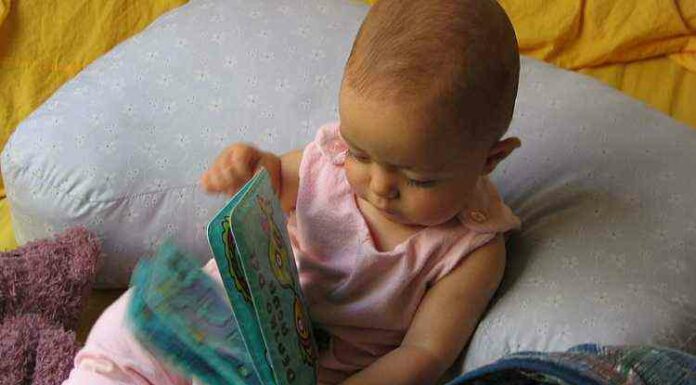 Small baby with book