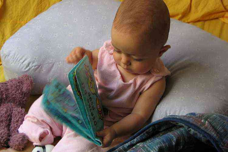 Small baby with book