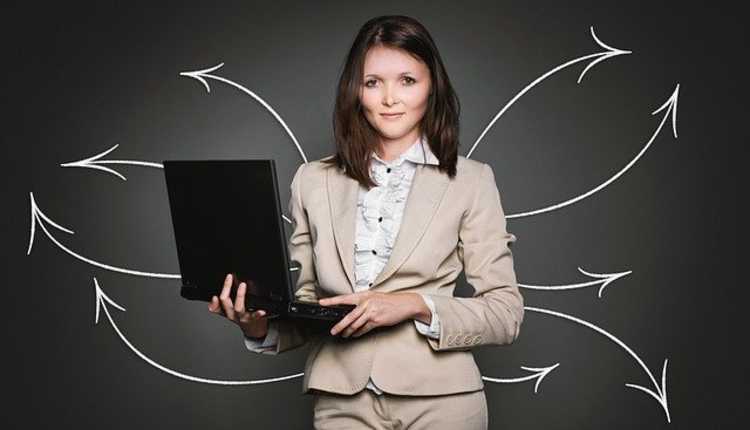 working women, employed women, laptop, standing 