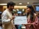 Indian Politician Handing Over A Check To A Social Media Influencer Of Indian